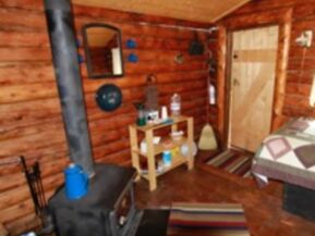 Wood stove and interior of Bear's Den Cabin