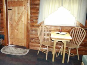 Table and chairs inside of Grub Steak cabin