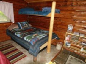 Bed inside of The Duke cabin