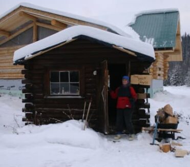 Log cabin in snow