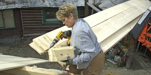 Jill helping to build log cabin